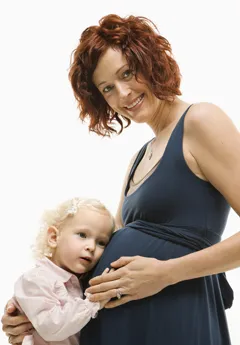 pregnant woman with daughter